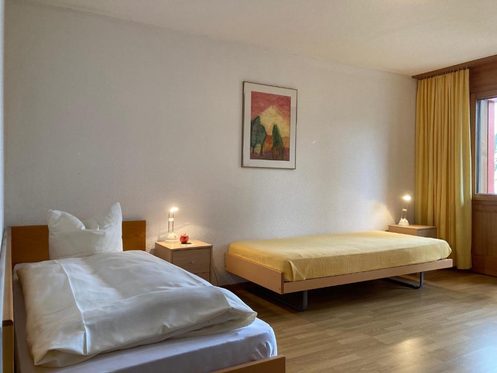 Postel nebo postele na pokoji v ubytování zentrumRANFT Seminarhaus - Haus der Stille