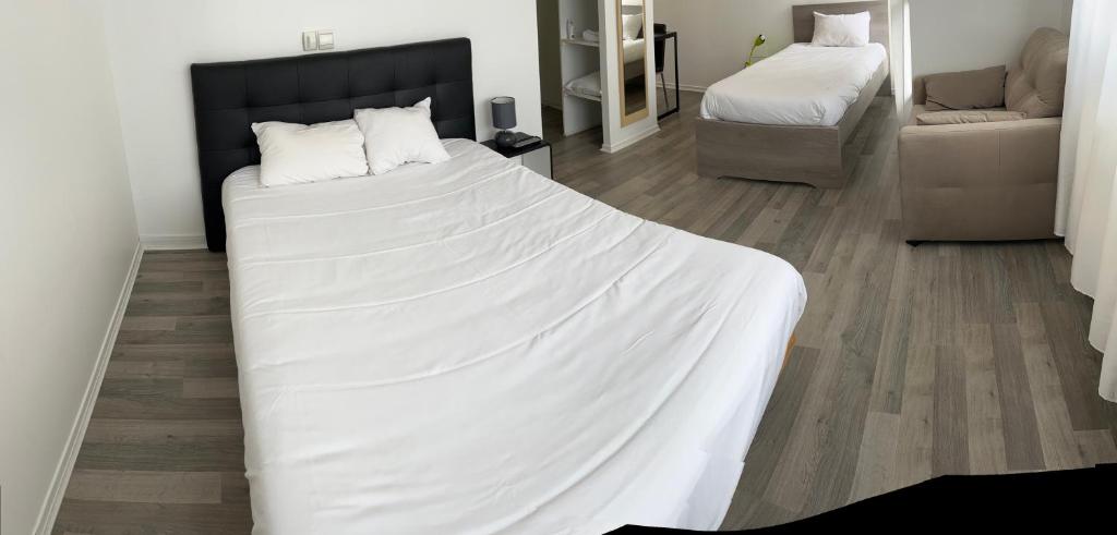 Postel nebo postele na pokoji v ubytování Hotel Restaurant Rolland