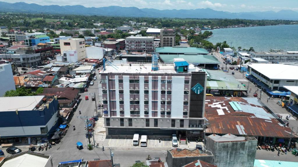 an aerial view of a city with a large building at Fan's Hotel- Ormoc in Ormoc