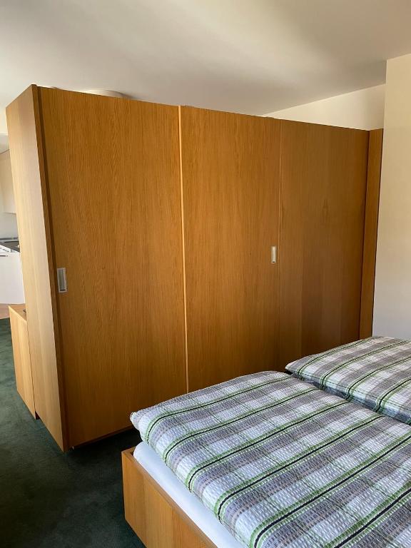 Postel nebo postele na pokoji v ubytování Gästehaus WOHNPARK St. Chrischona