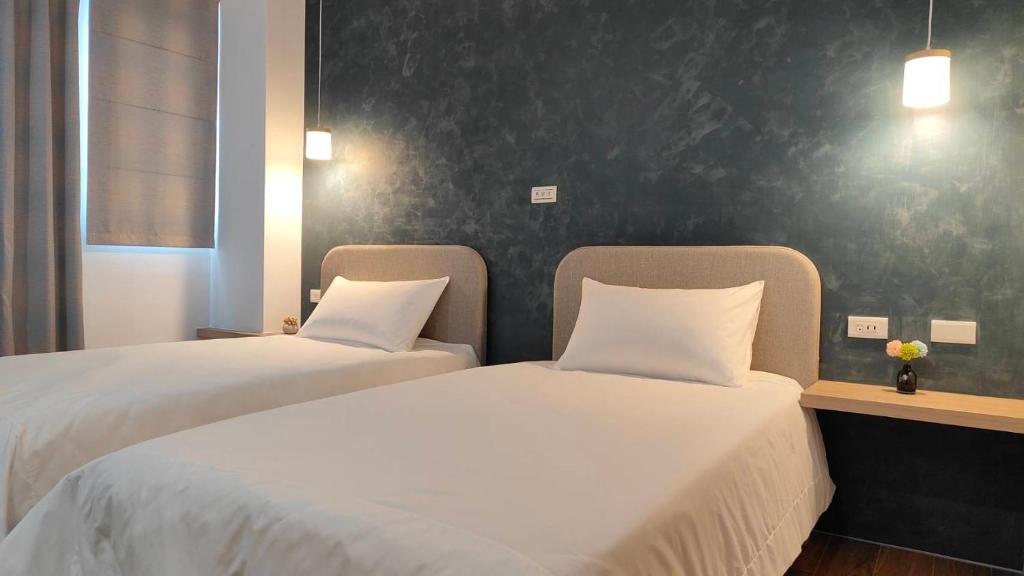 Postel nebo postele na pokoji v ubytování Mi Hai B&B