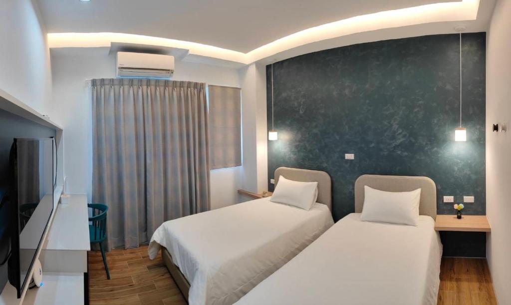 Postel nebo postele na pokoji v ubytování Mi Hai B&B