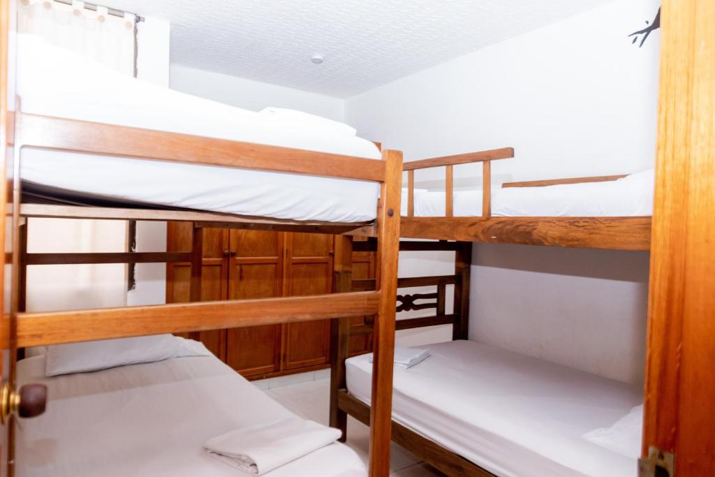 Postel nebo postele na pokoji v ubytování Edificio Sandra
