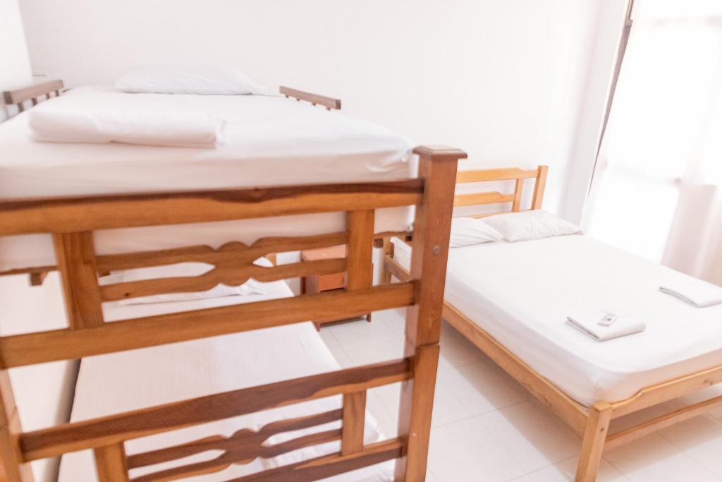 Postel nebo postele na pokoji v ubytování Edificio Sandra