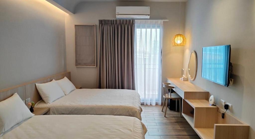 Postel nebo postele na pokoji v ubytování Mi Hai B&B