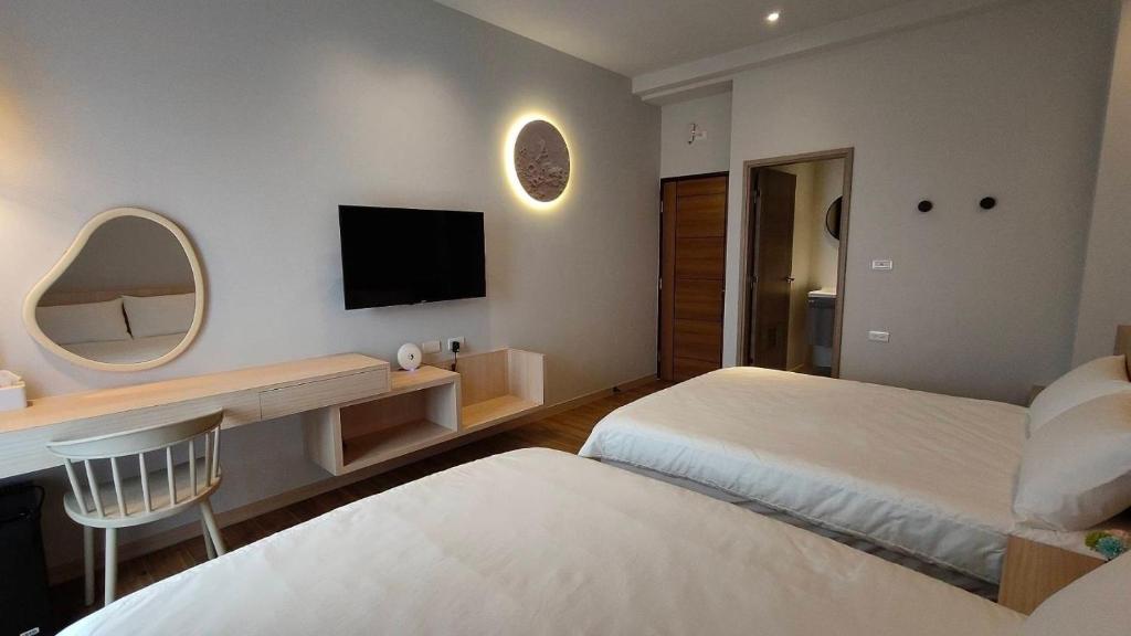Postel nebo postele na pokoji v ubytování Mi Hai B&B