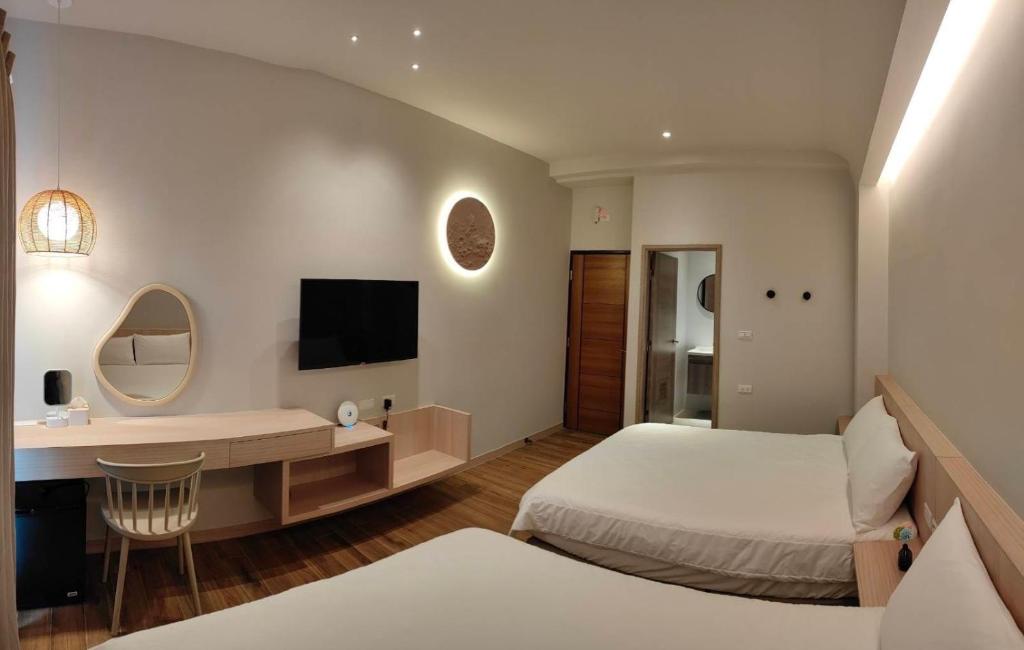 Postel nebo postele na pokoji v ubytování Mi Hai B&B