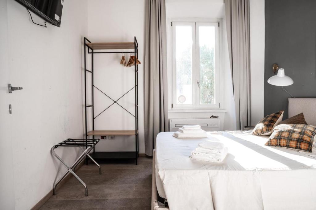 Łóżko lub łóżka w pokoju w obiekcie Vatican Suites - The Luxury Leading Accommodation in Rome