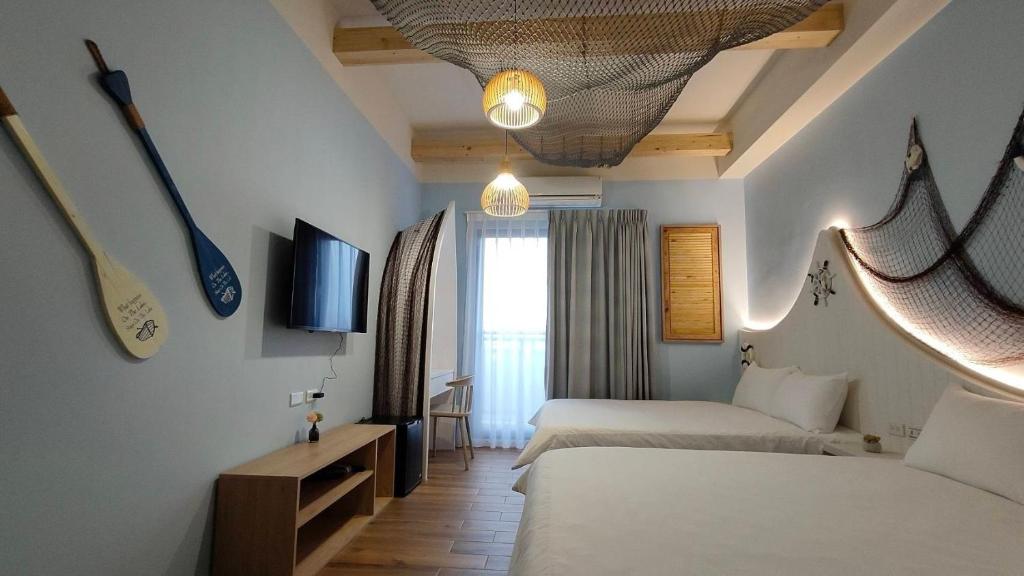 Postel nebo postele na pokoji v ubytování Mi Hai B&B