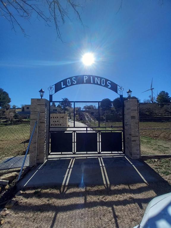 a gate to a los pines parking lot at Los Pinos Munera in Munera