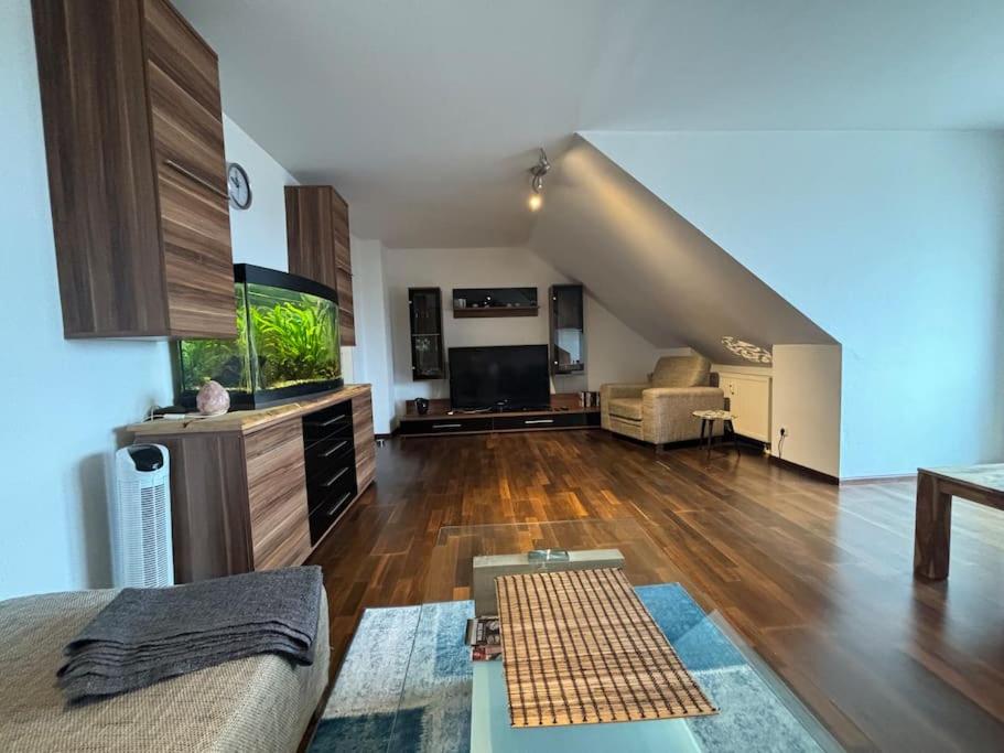 a large living room with a couch and a table at Fewo Thermenhafen Erding in Erding