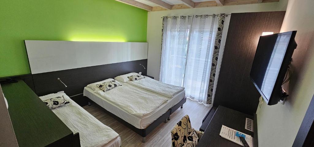 TV a/nebo společenská místnost v ubytování Ecohotel Primavera