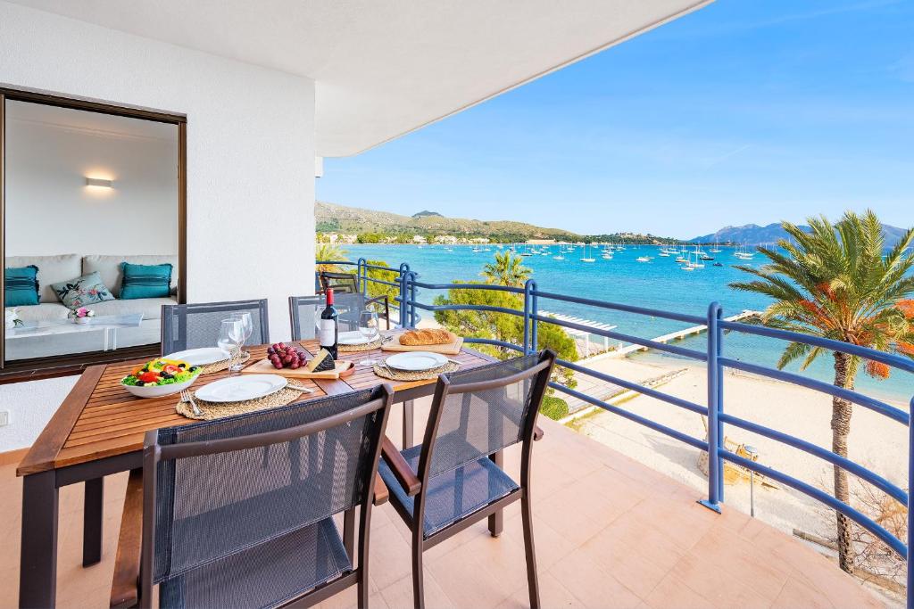 a dining room with a view of the ocean at NEW Seaview Ap Anita by JS Villas in Port de Pollensa