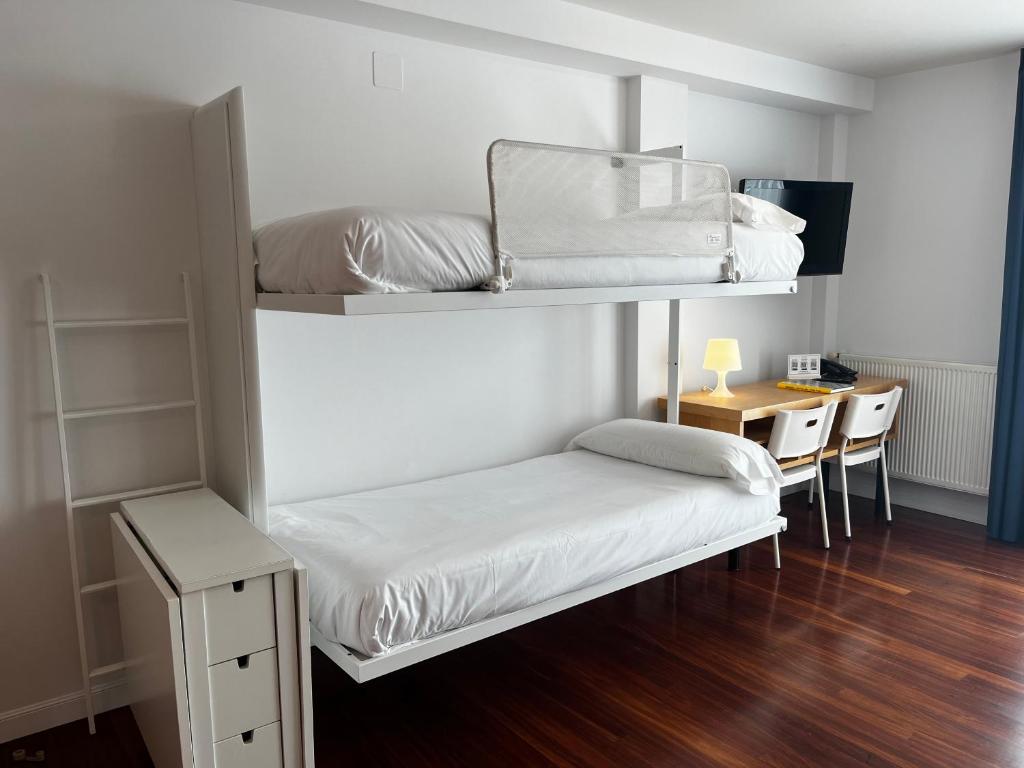Postel nebo postele na pokoji v ubytování Apartamentos Mundaka