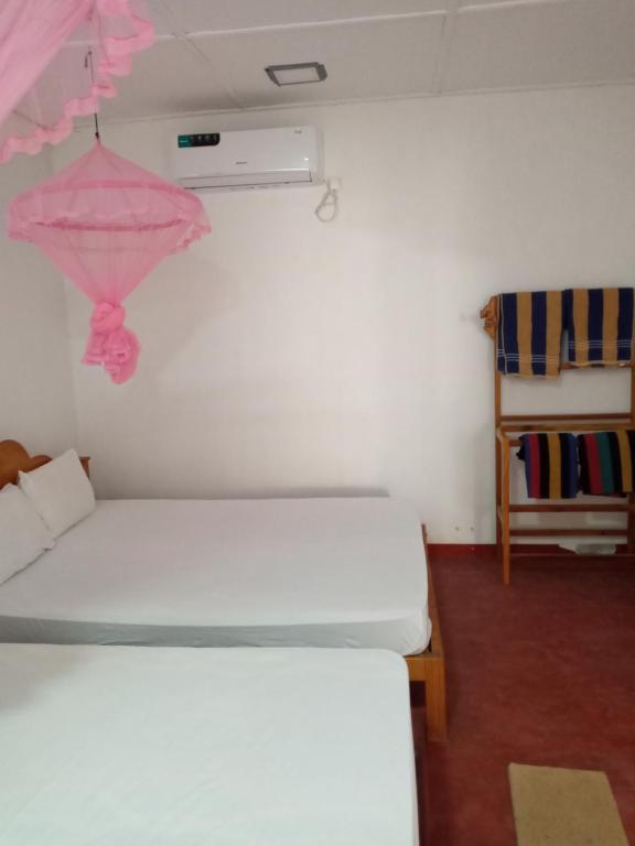 Postel nebo postele na pokoji v ubytování U new guest house