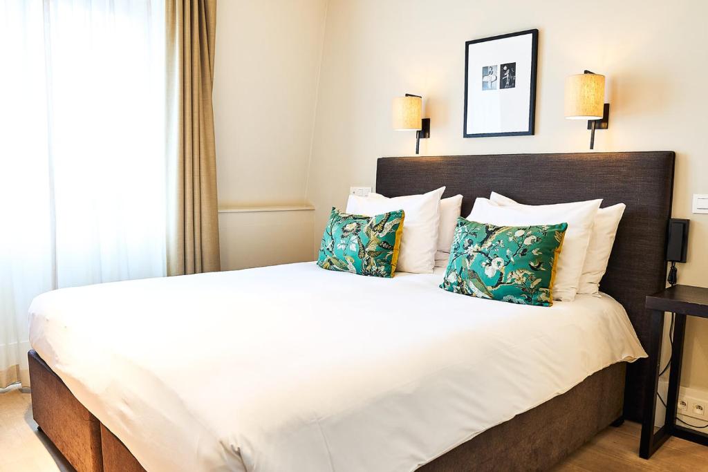 Postel nebo postele na pokoji v ubytování Hotel FRANQ