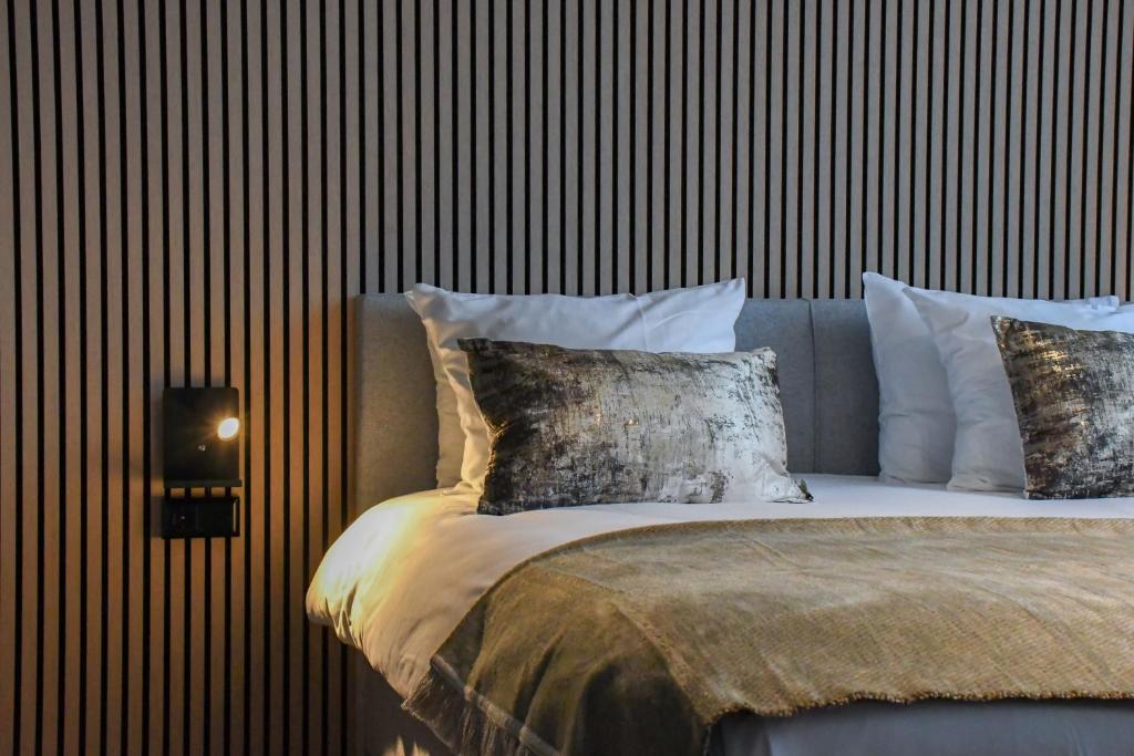 Een bed of bedden in een kamer bij Veluwe Hotel De Beyaerd