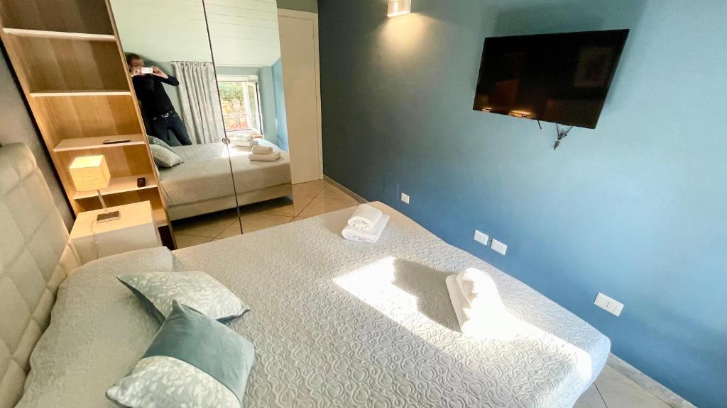 Postel nebo postele na pokoji v ubytování Casa Di Emma (camera Ponente)