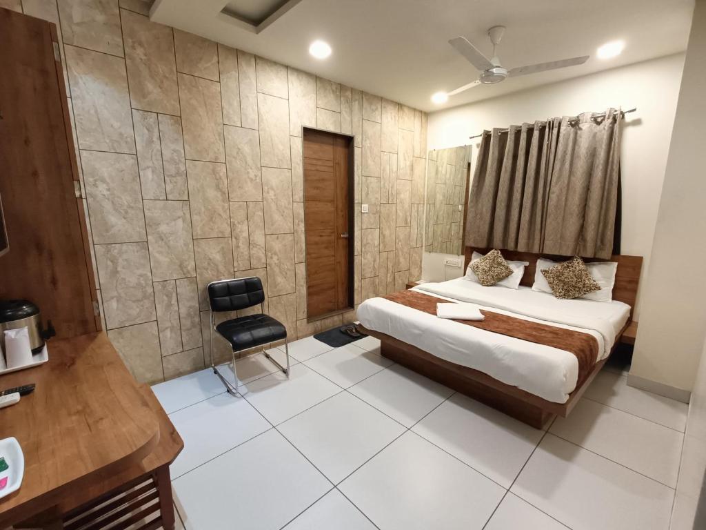 Postel nebo postele na pokoji v ubytování Hotel Kinara