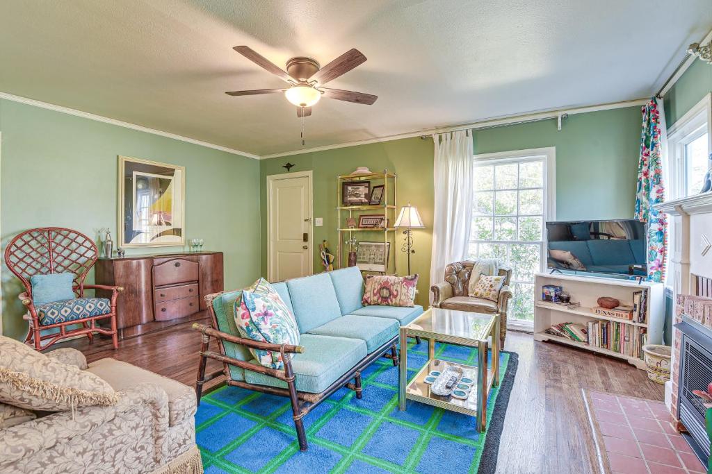 a living room with a couch and a tv at Quiet Fort Worth Home Less Than 1 Mi to TCU Campus! in Fort Worth