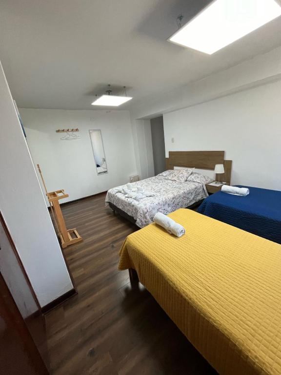 Ένα ή περισσότερα κρεβάτια σε δωμάτιο στο Harmony Inn Miraflores