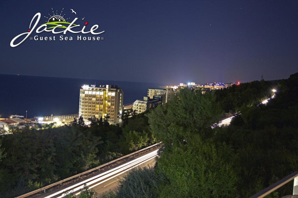 a view of a city at night at Villa Jackie in Golden Sands