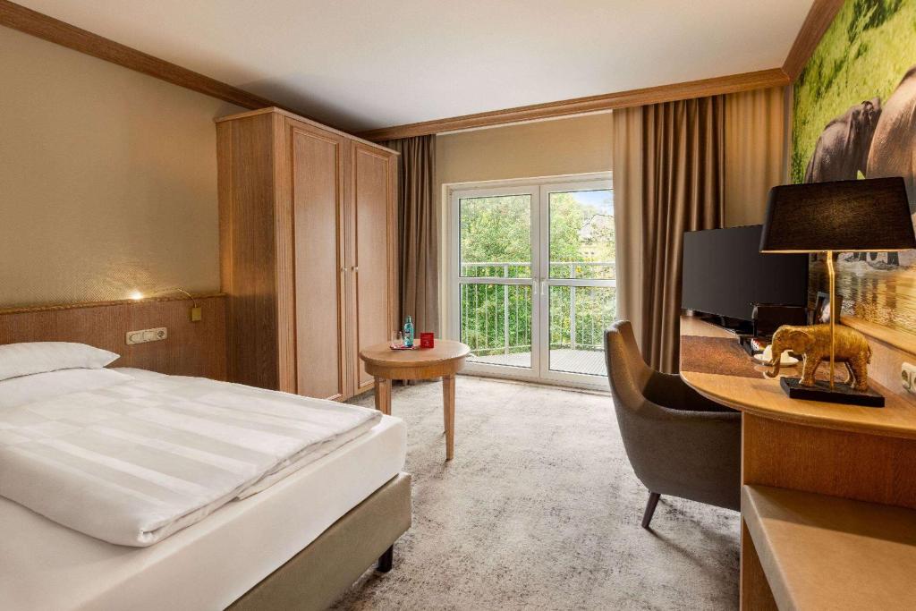 Postel nebo postele na pokoji v ubytování Amedia Hotel & Suites Leipzig, Trademark Collection by Wyndham