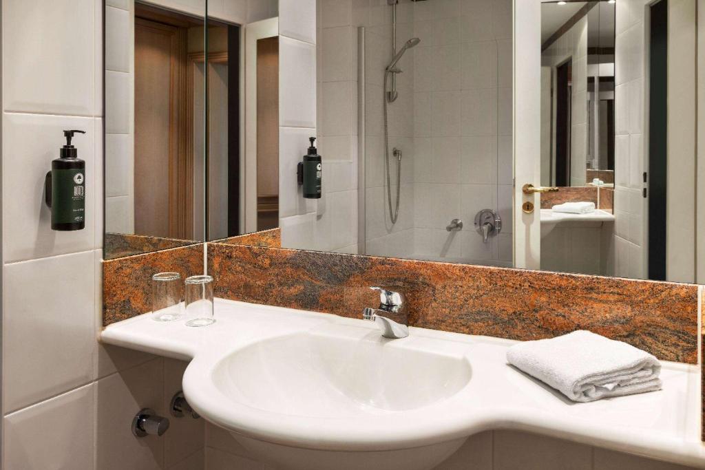 Koupelna v ubytování Amedia Hotel & Suites Leipzig, Trademark Collection by Wyndham