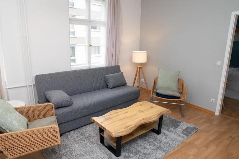 a living room with a couch and a coffee table at Great Central City Apartments Mitte Museumsinsel in Berlin