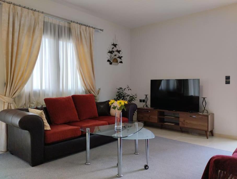 a living room with a couch and a coffee table at XΡΗΣΤΟΣ house in Ioannina