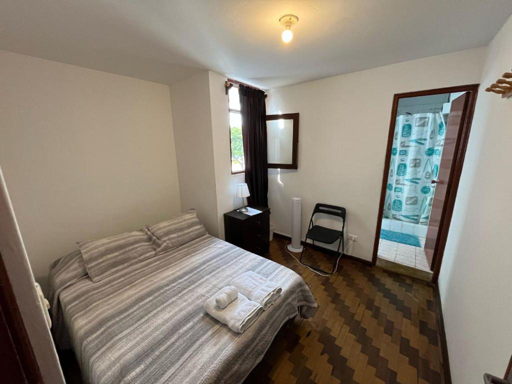 Ένα ή περισσότερα κρεβάτια σε δωμάτιο στο Harmony Inn Miraflores