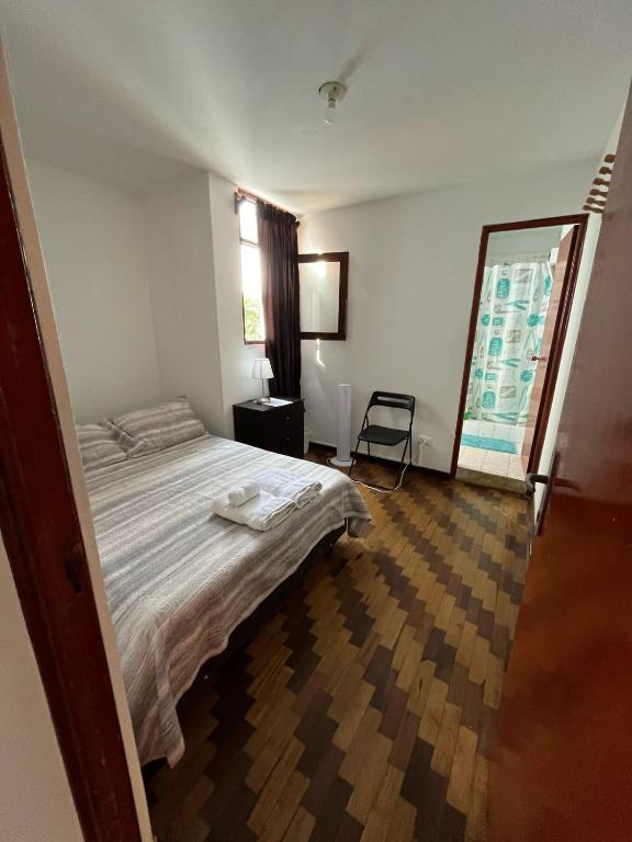 Ένα ή περισσότερα κρεβάτια σε δωμάτιο στο Harmony Inn Miraflores