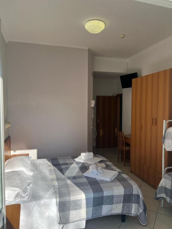 Postel nebo postele na pokoji v ubytování Hotel Blue Ribbon
