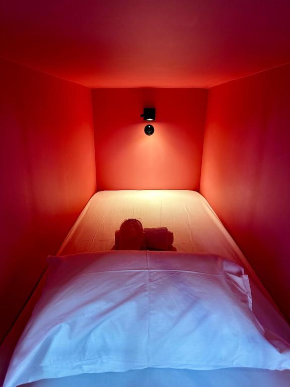 Postel nebo postele na pokoji v ubytování Pink Mango