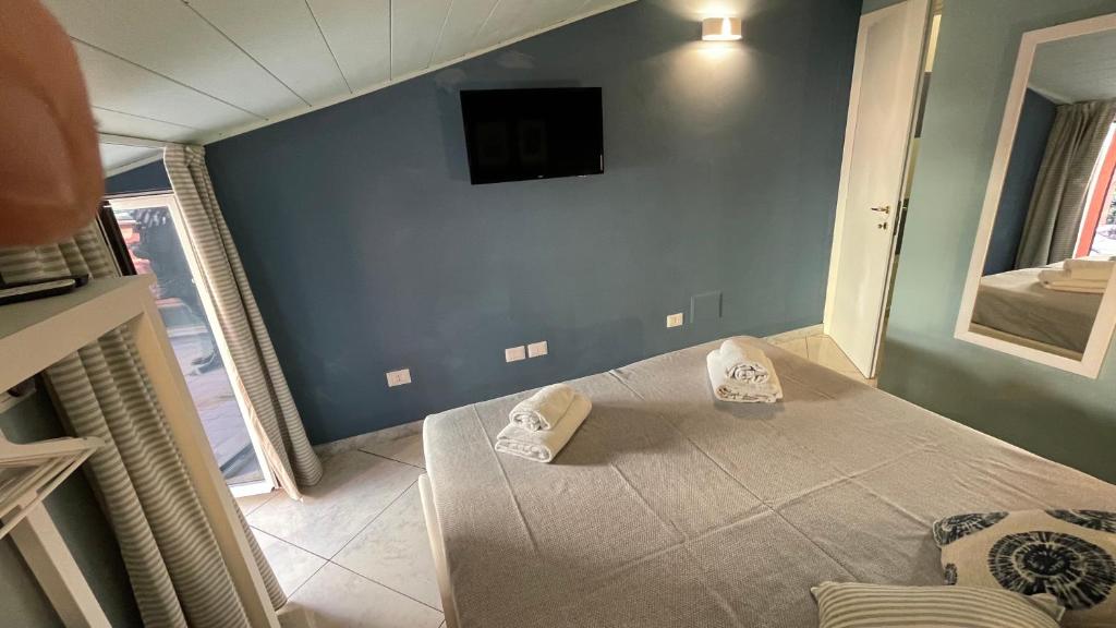 Postel nebo postele na pokoji v ubytování Casa Di Emma (camera Ponente)