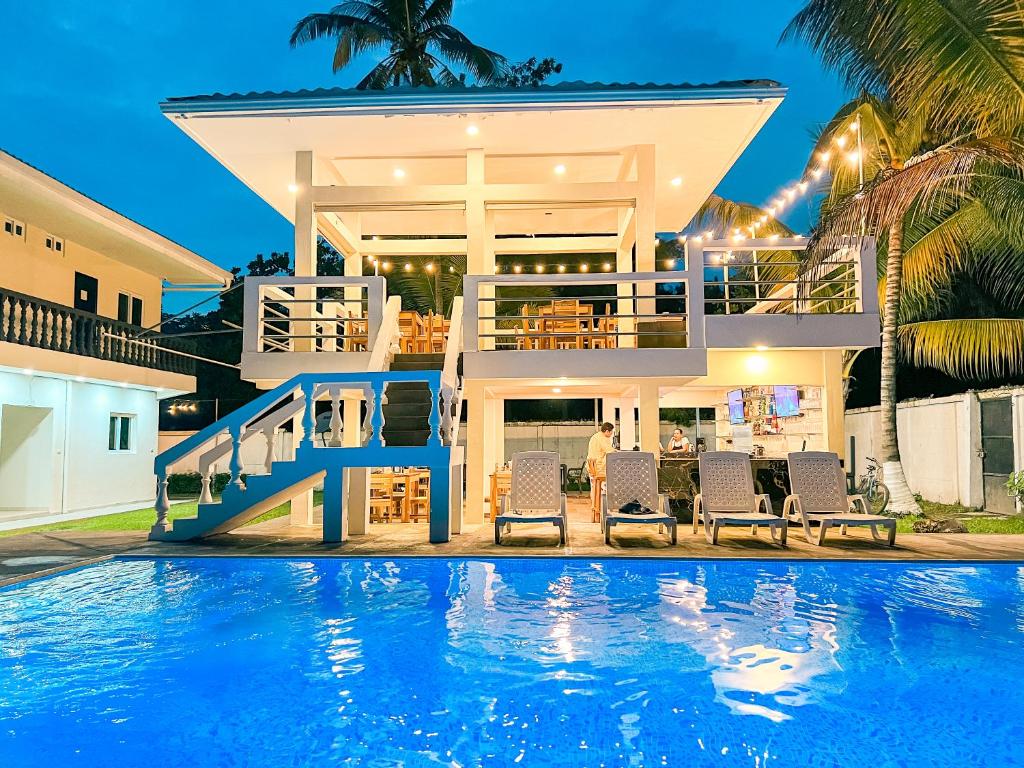 a villa with a swimming pool at night at amaremar in San Luis