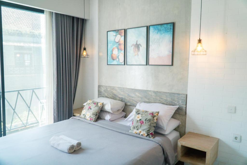 Postel nebo postele na pokoji v ubytování Gemini Star Hotel