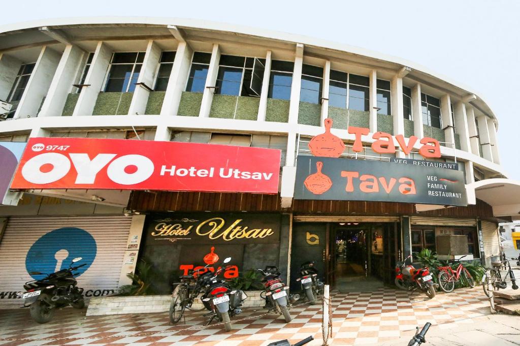 a building with motorcycles parked in front of it at OYO Hotel Utsav in Jabalpur