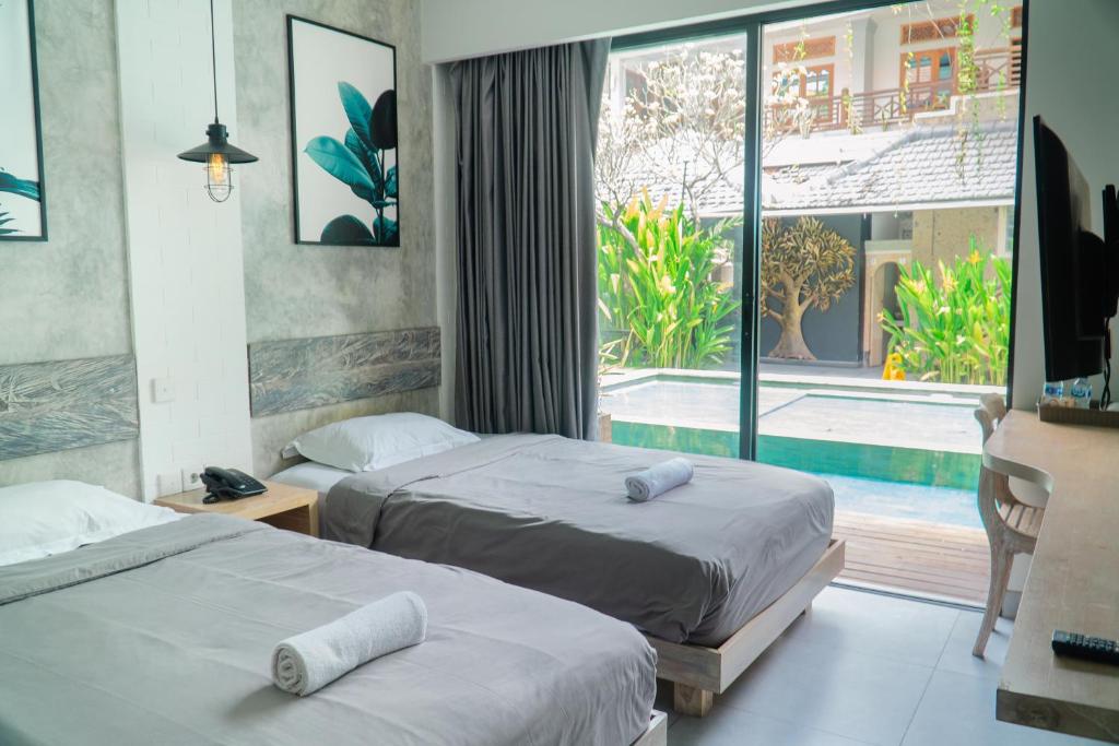 Postel nebo postele na pokoji v ubytování Gemini Star Hotel