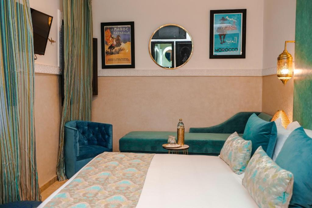 Postel nebo postele na pokoji v ubytování Riad Roummana Marrakech