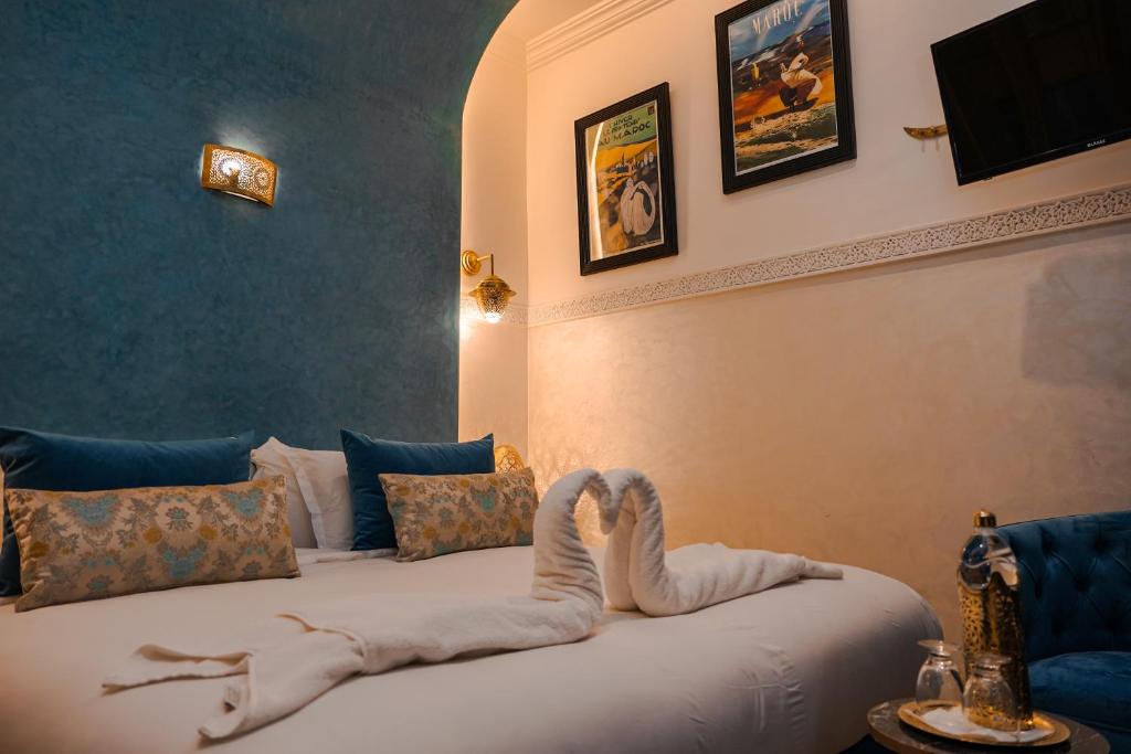 Postel nebo postele na pokoji v ubytování Riad Roummana Marrakech