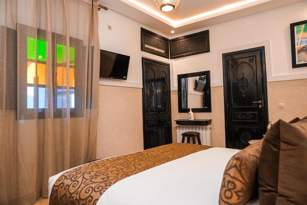 Postel nebo postele na pokoji v ubytování Riad Roummana Marrakech