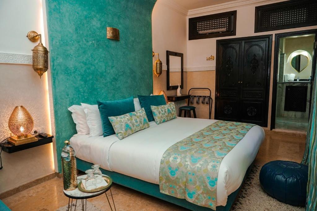 Postel nebo postele na pokoji v ubytování Riad Roummana Marrakech