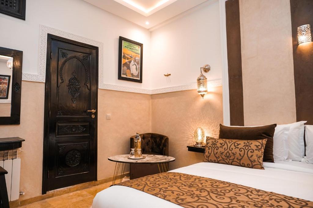 Postel nebo postele na pokoji v ubytování Riad Roummana Marrakech