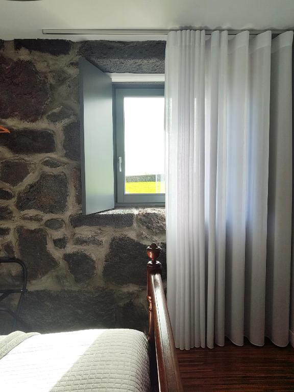 Postel nebo postele na pokoji v ubytování Quinta dos Mistérios- Turismo de Habitação