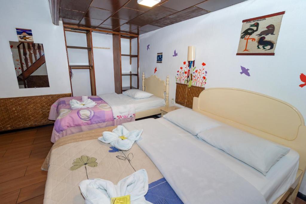 Postel nebo postele na pokoji v ubytování Santa Cruz Backpackers Hostal