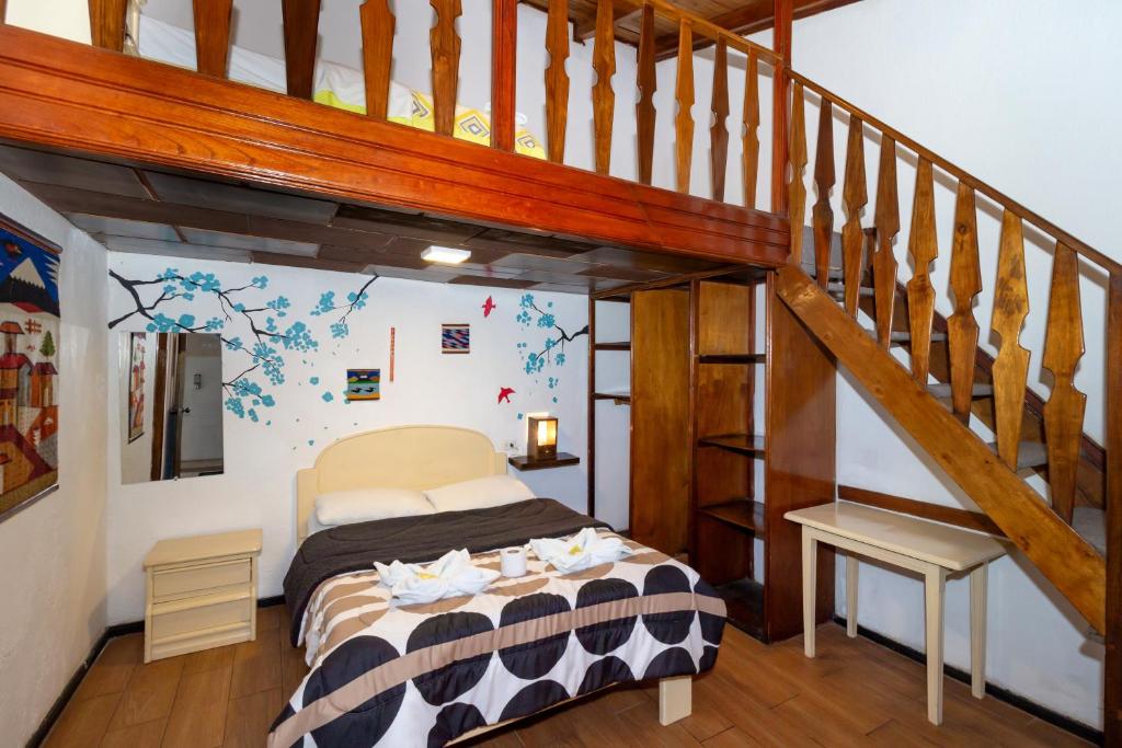 Postel nebo postele na pokoji v ubytování Santa Cruz Backpackers Hostal