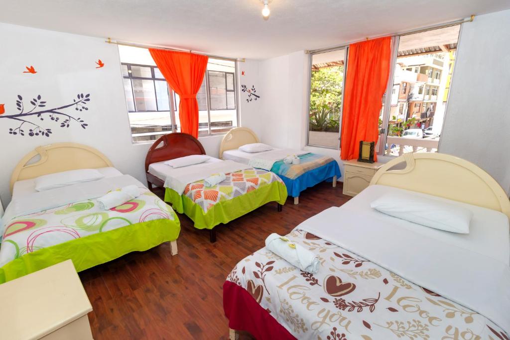 Postel nebo postele na pokoji v ubytování Santa Cruz Backpackers Hostal