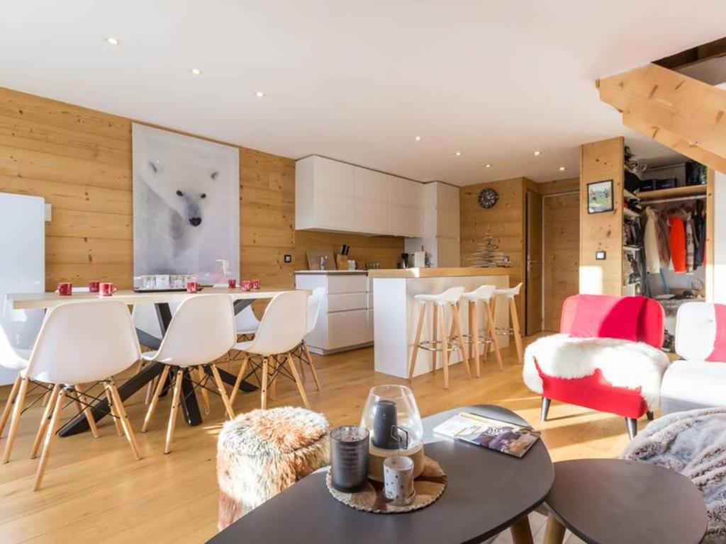 a kitchen and living room with a table and chairs at Appartement Les Arcs 1800, 4 pièces, 8 personnes - FR-1-346-321 in Arc 1800