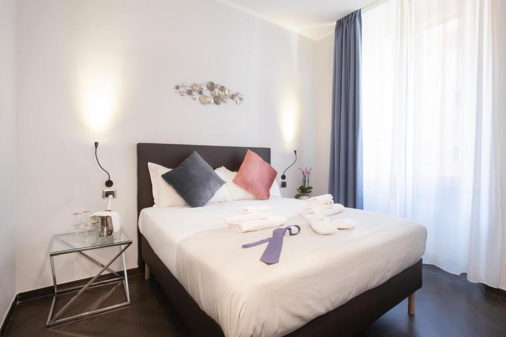 Postel nebo postele na pokoji v ubytování Cloud 9 Hotel